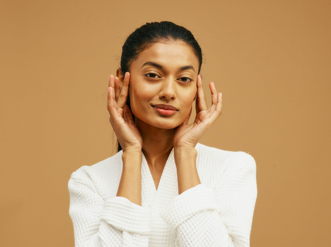 woman model holding her face