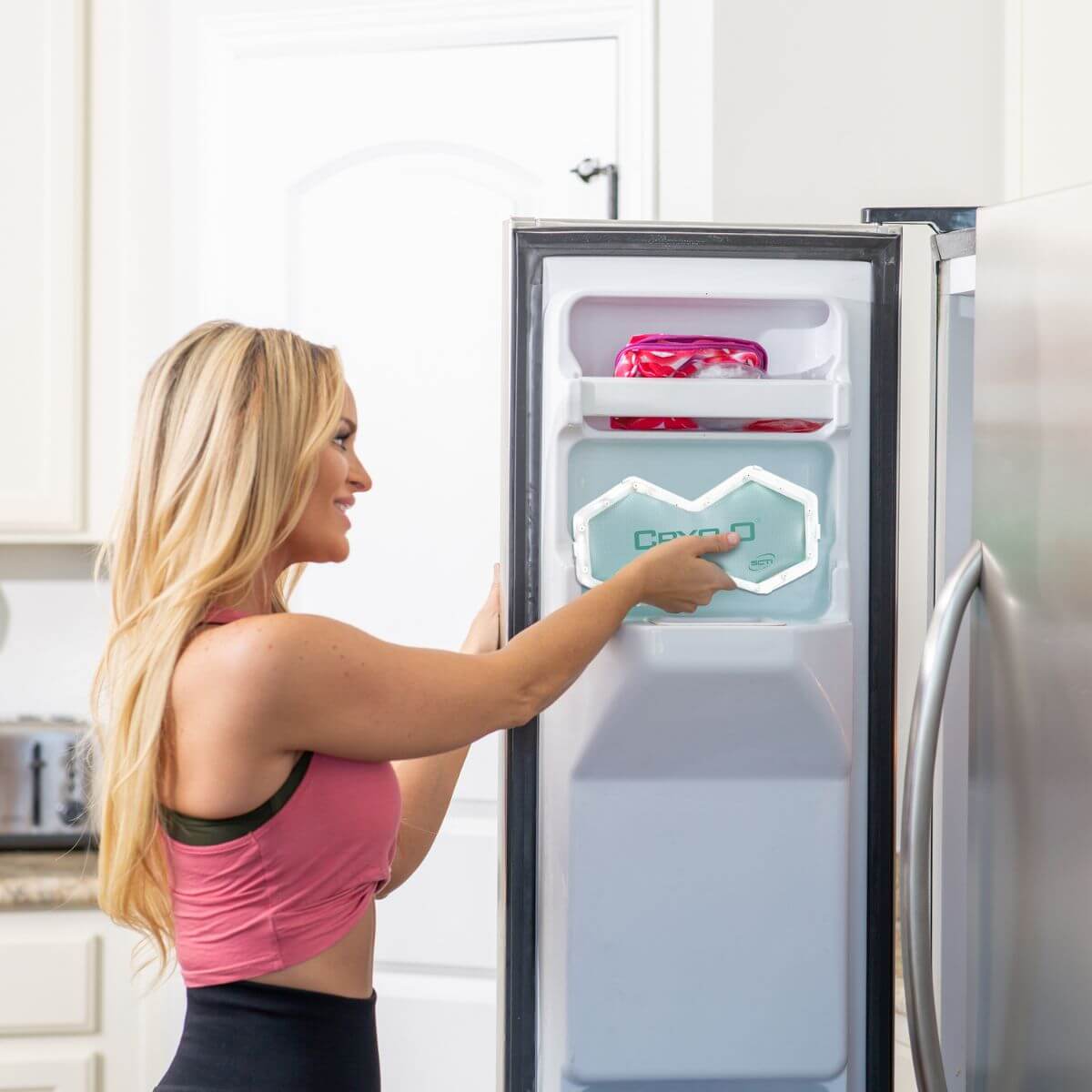 Woman putting Cryo2O Sculpt in the freezer